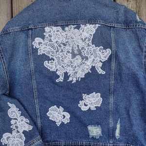 Distressed denim and lace jacket
